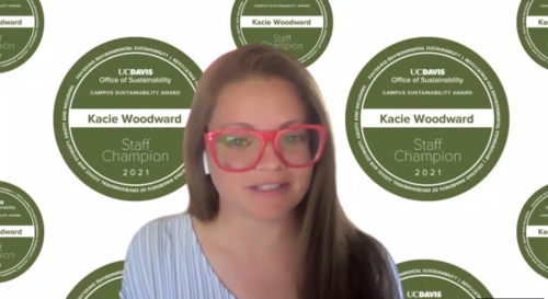 Kacie Woodward speaks in front of a background that identifies her as a UC Davis Staff Sustainability Champion